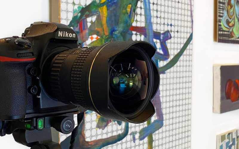 Camera in front of paintings